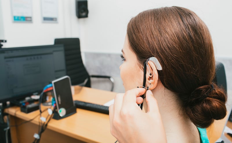 Patient trying a hearing aid