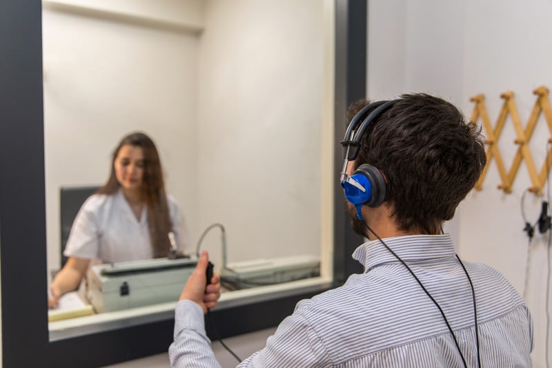Audiologist performing a hearing test
